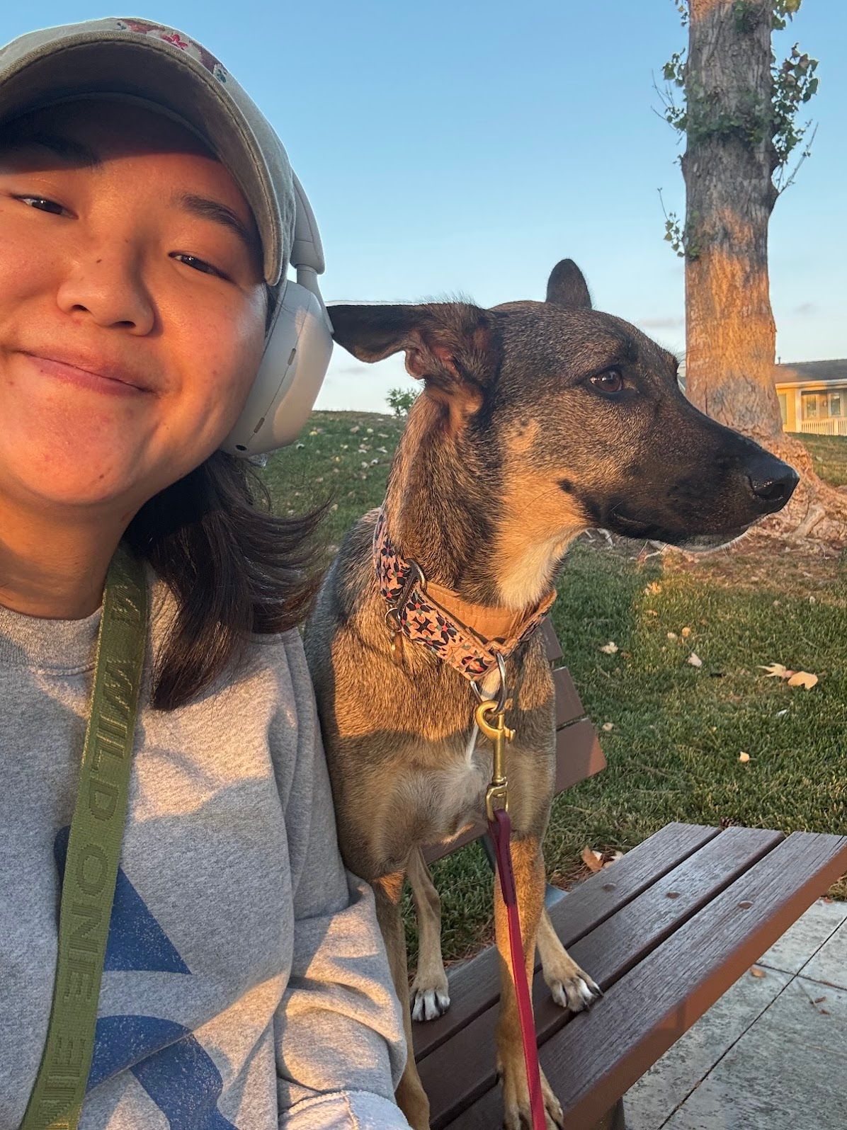 Eun Ji and Luca on a park bench at sunset